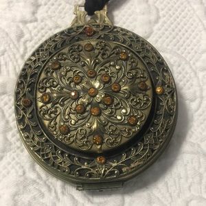 Antique collectible clutch amber color with metal